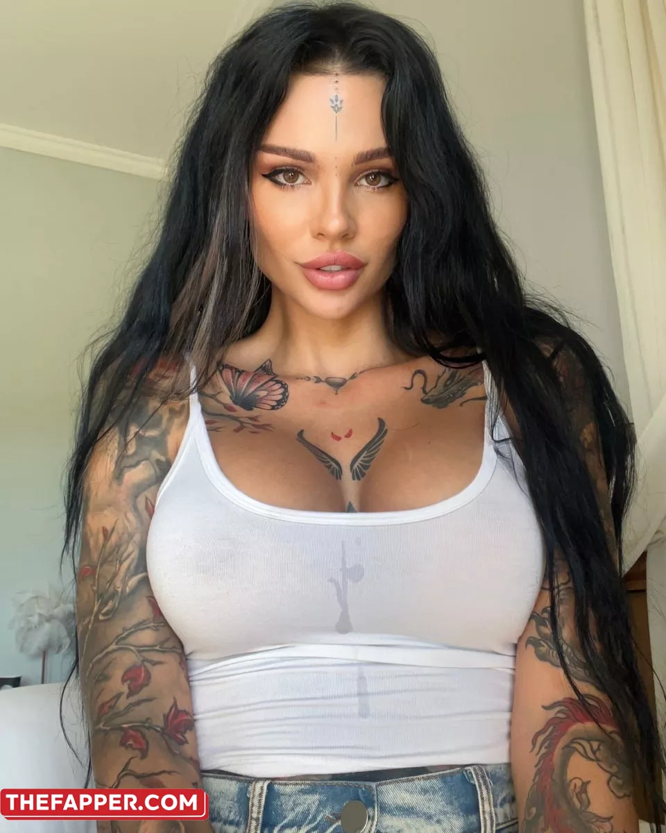 OnlyFans Bimbo Sunny Free Teases Her Large Breasts And Inked Body #1