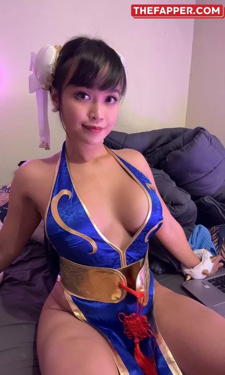 Merely A Brunette Fan Darling Asian Eye Teases With A Provocative Attire And A Large Cleavage #1